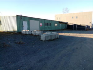 Outdoor picture of garage door of warehouse for commercial lease in Anchorage, Alaska