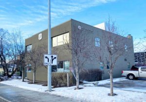 Downtown office building in Anchorage Alaska for sale. Clear skies.